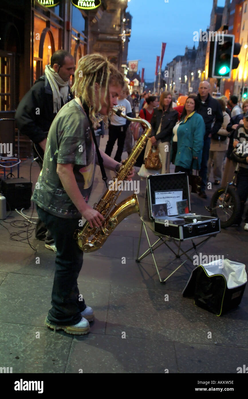 Edinburgh Festival Scotland Fringe female Sax player busking on