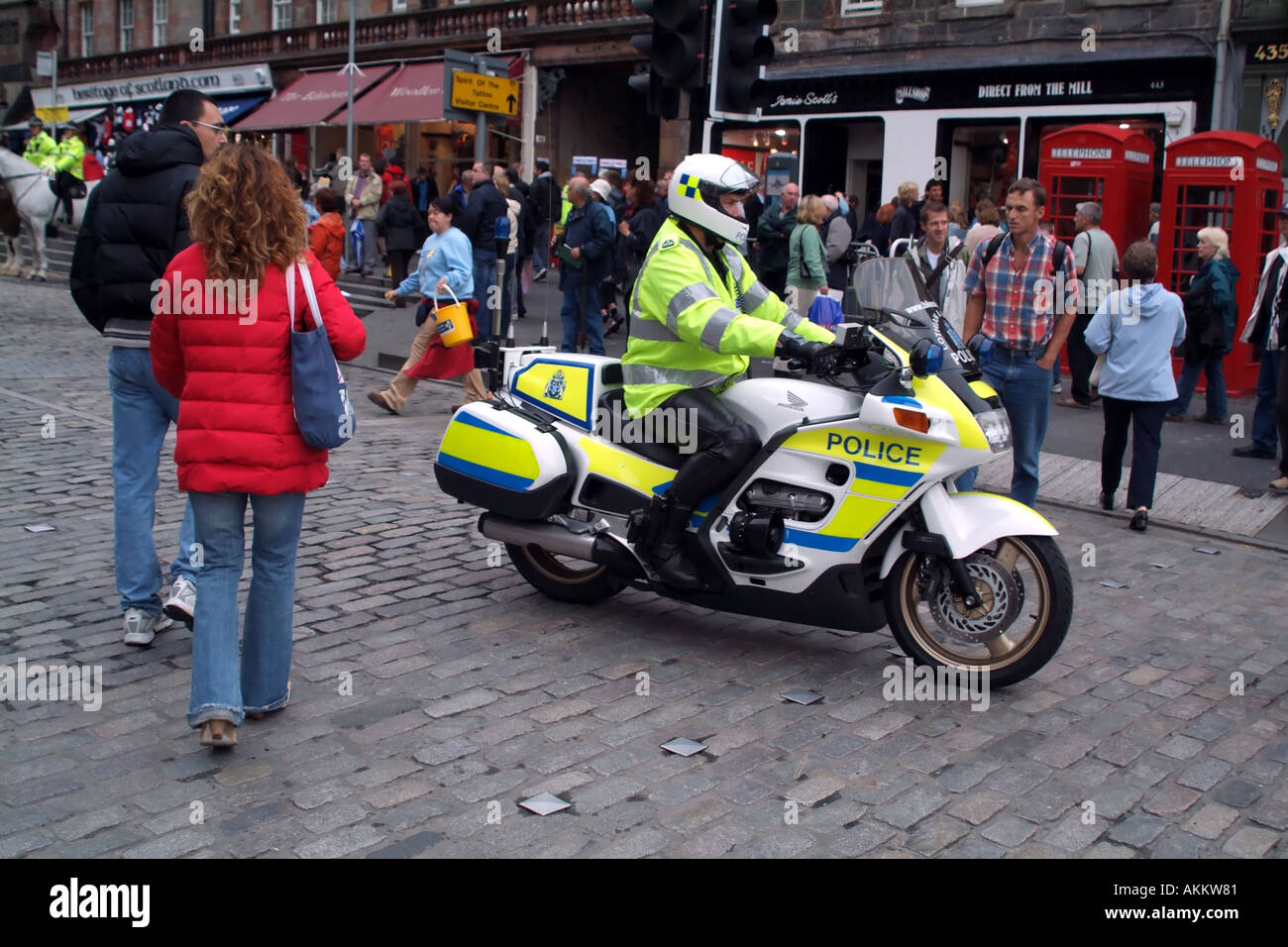 Lothian and Borders police motorcyclist patrol The Royal Mile Edinburgh Scotland UK Europe Stock Photo