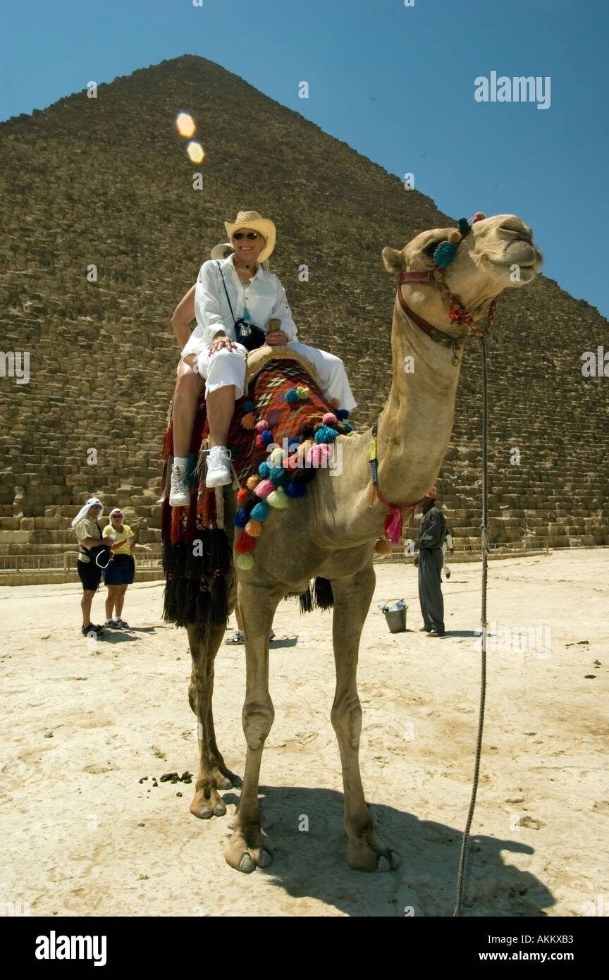 Tourists take camel rides at the Pyramids at Ghiza Cairo Egypt Stock ...