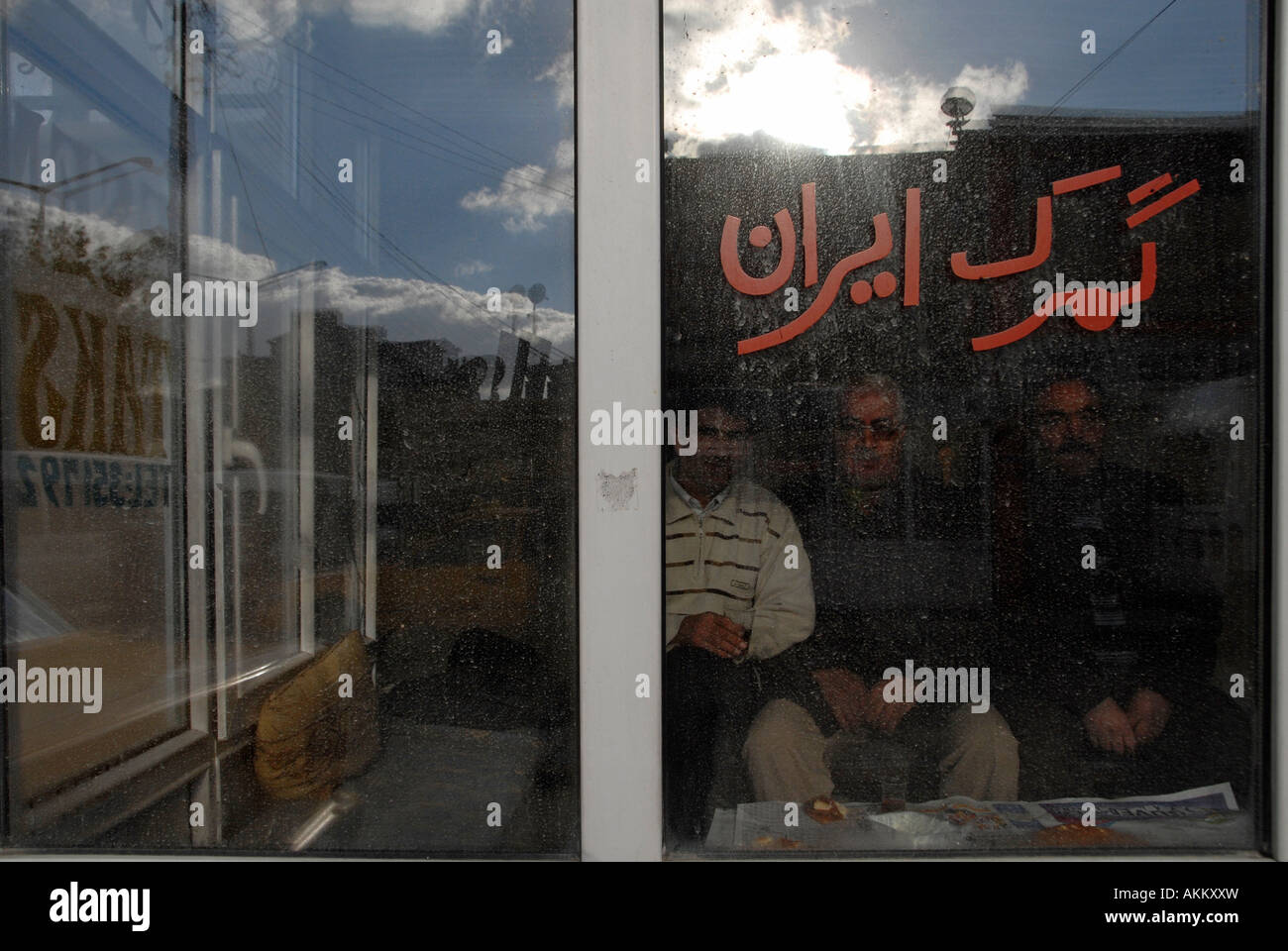 Kurdish residents seated inside a taxi booth in Yuksekova town near the ...