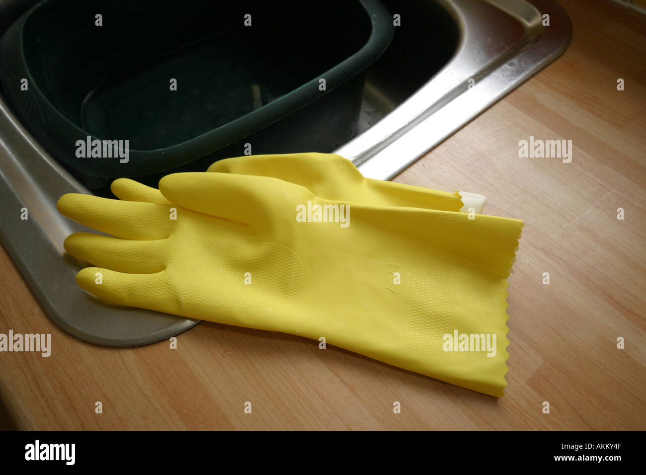 rubber gloves in kitchen Stock Photo Alamy