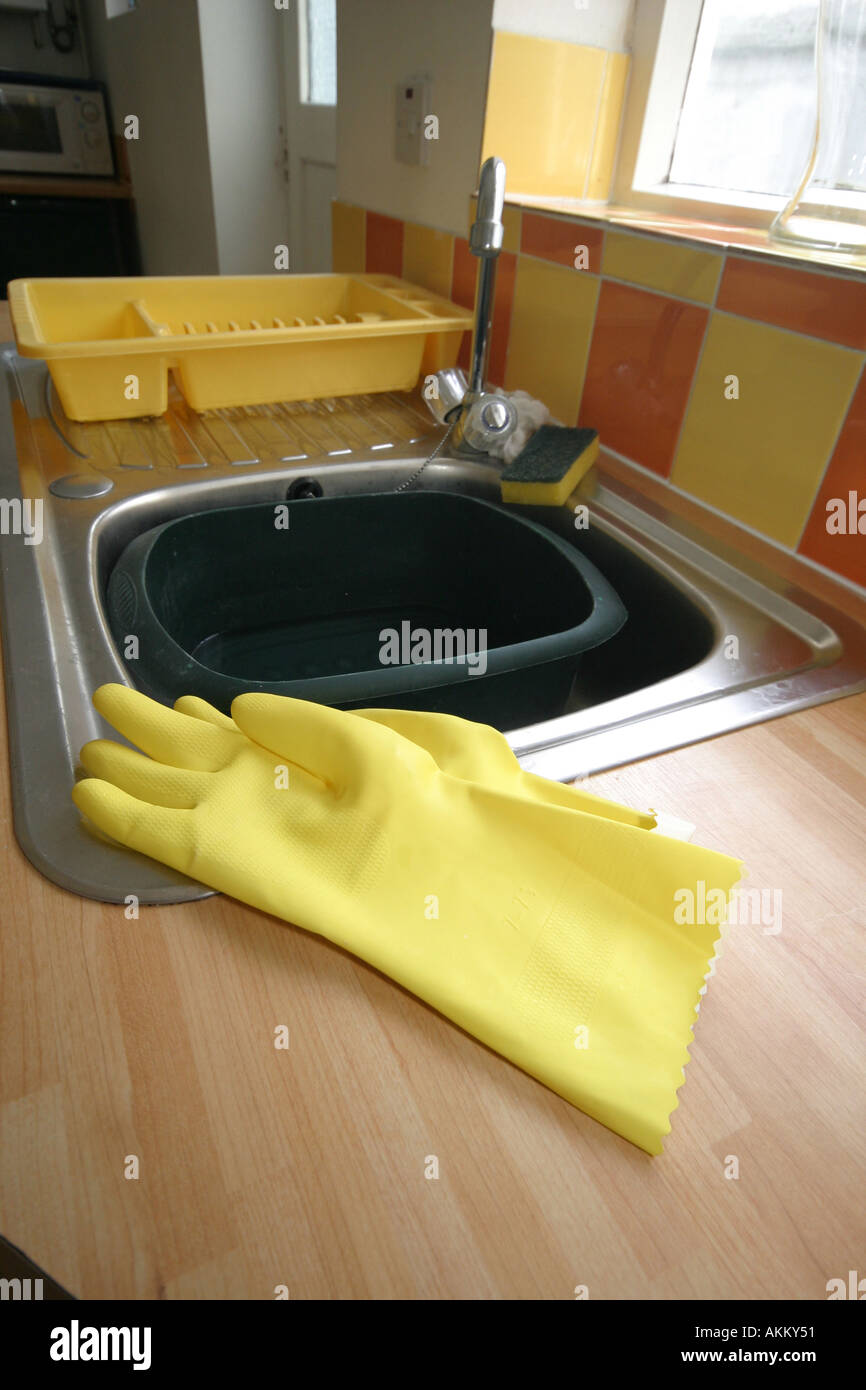 rubber gloves in kitchen Stock Photo Alamy
