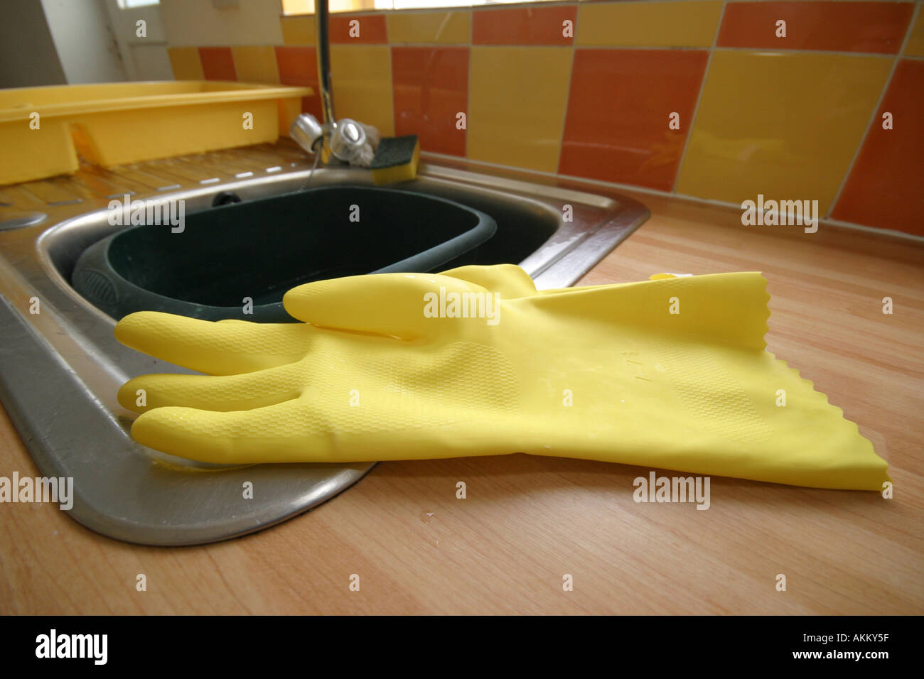 rubber gloves in kitchen Stock Photo Alamy