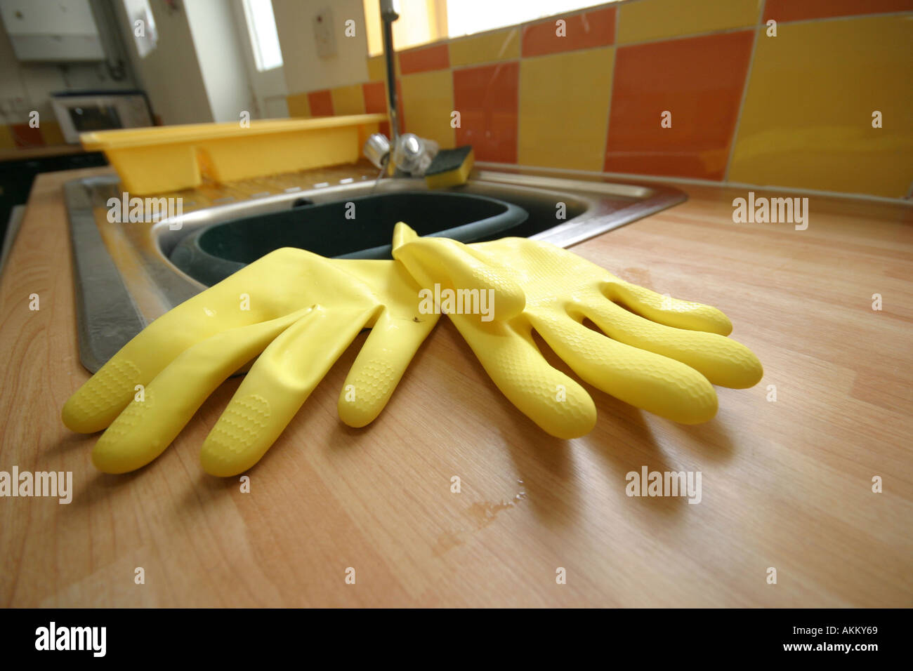rubber gloves in kitchen Stock Photo Alamy