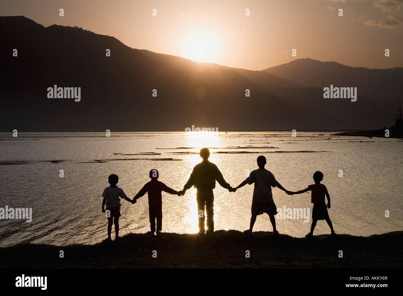 Group of people holding hands Stock Photo