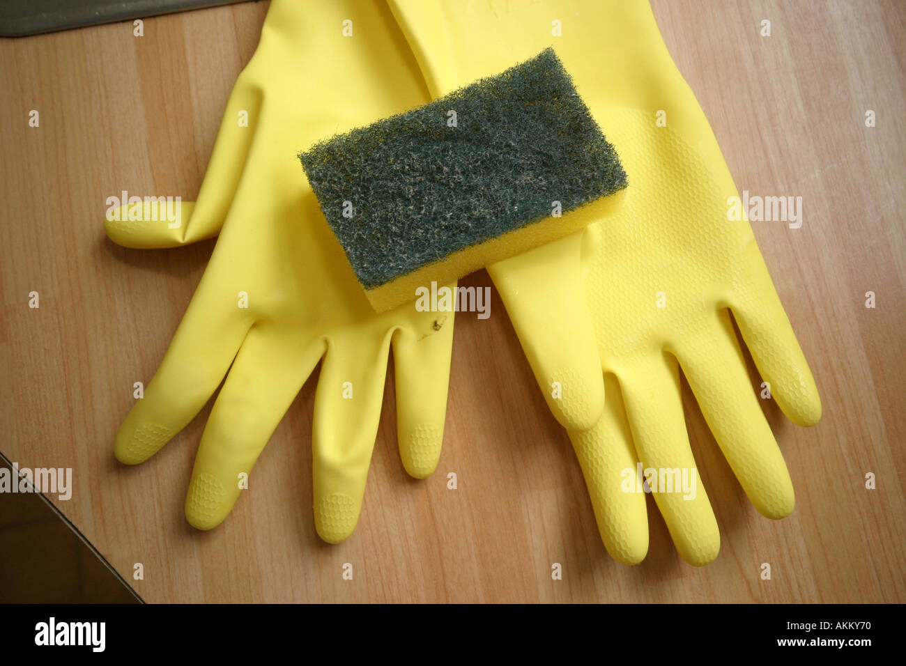 rubber gloves in kitchen with scrubber Stock Photo Alamy