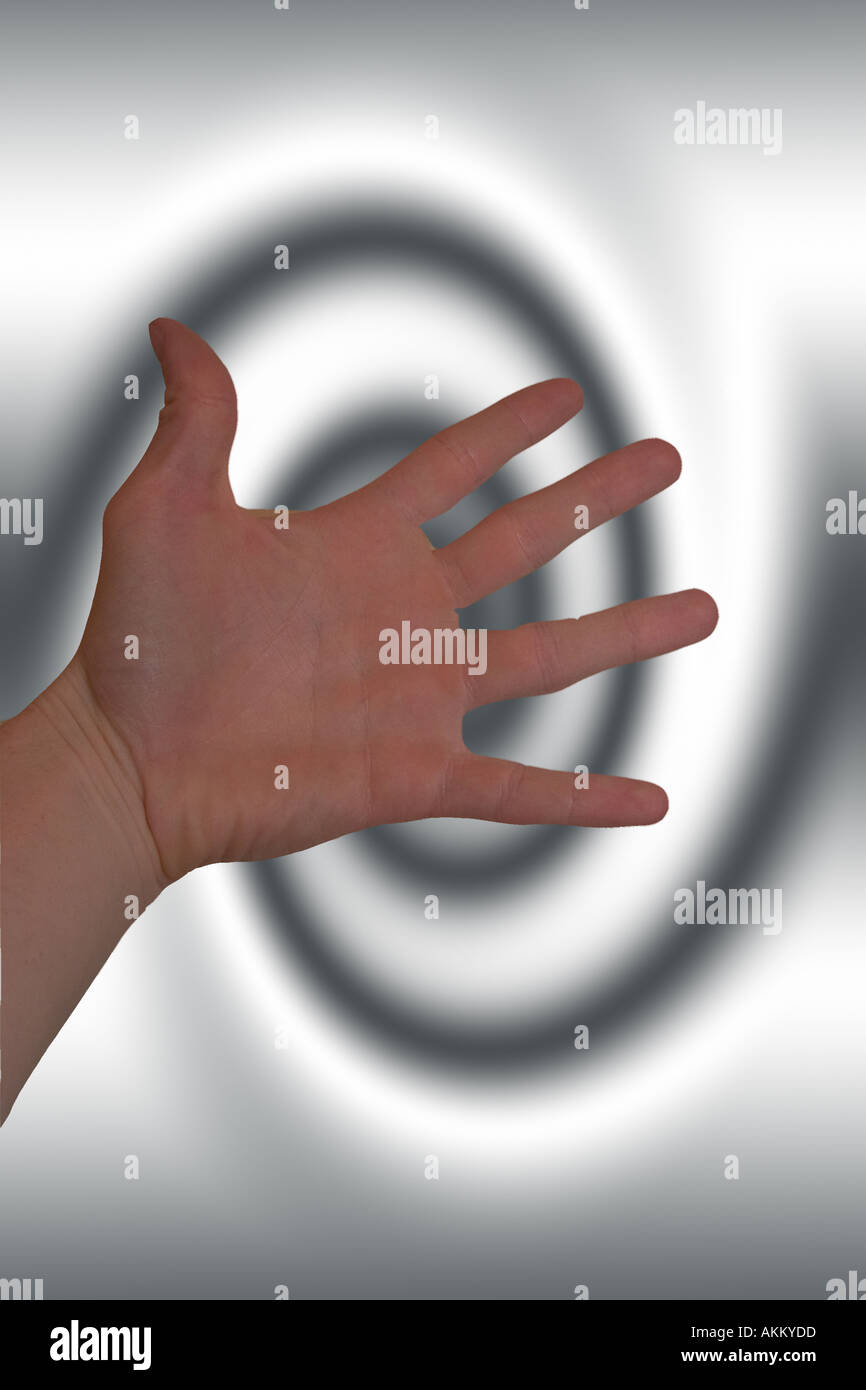 Hand Over Backdrop hand over a spiral background Stock Photo - Alamy
