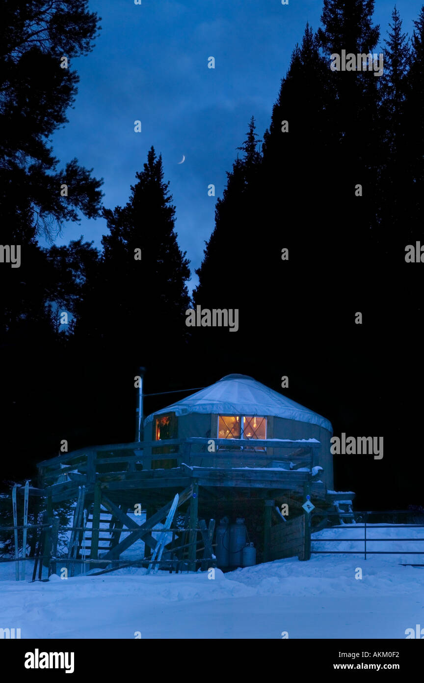 Backcountry yurt lit up at night in the Colorado State Forest State Park Gould Colorado USA