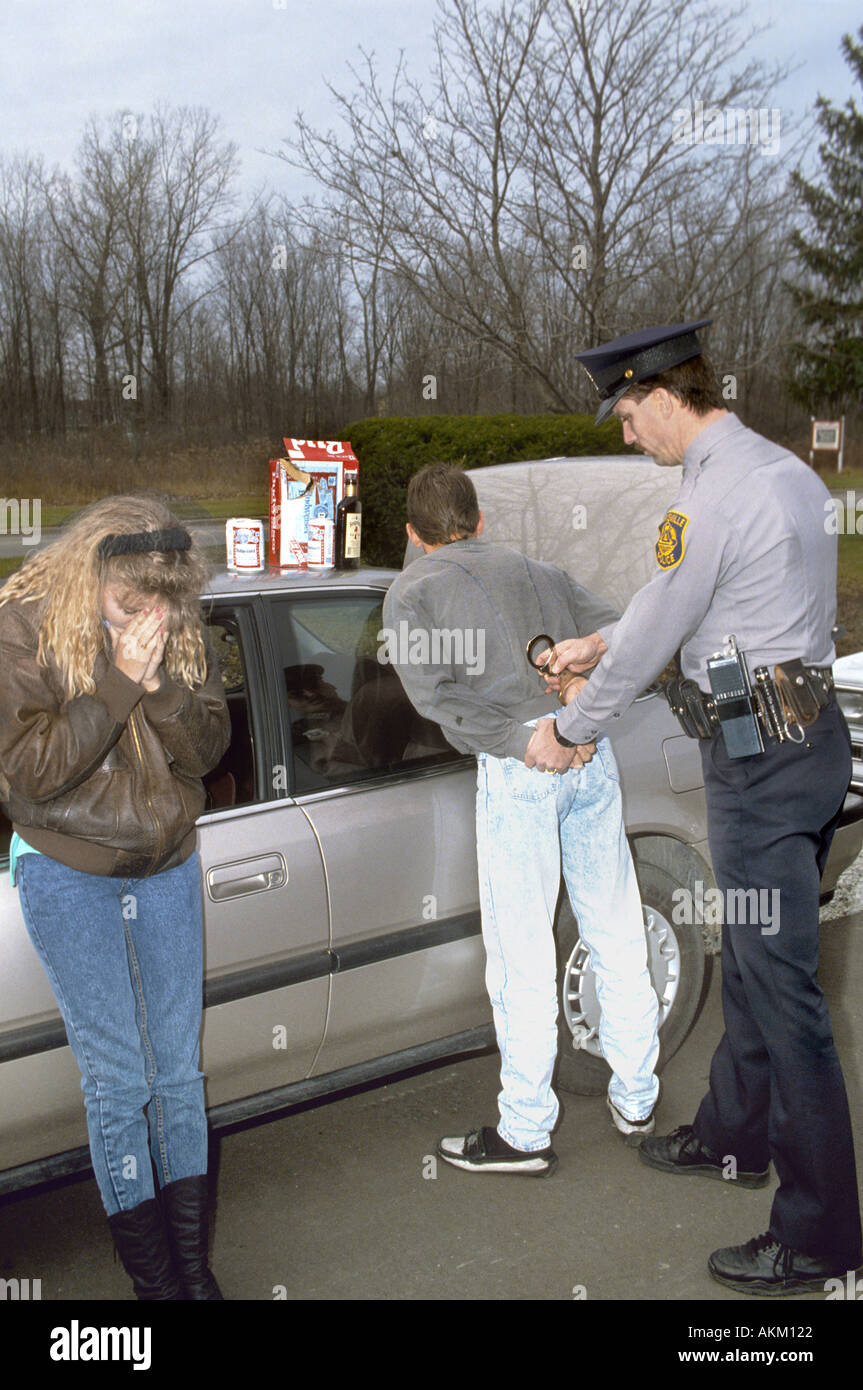 Alcohol abuse among young men and women Stock Photo