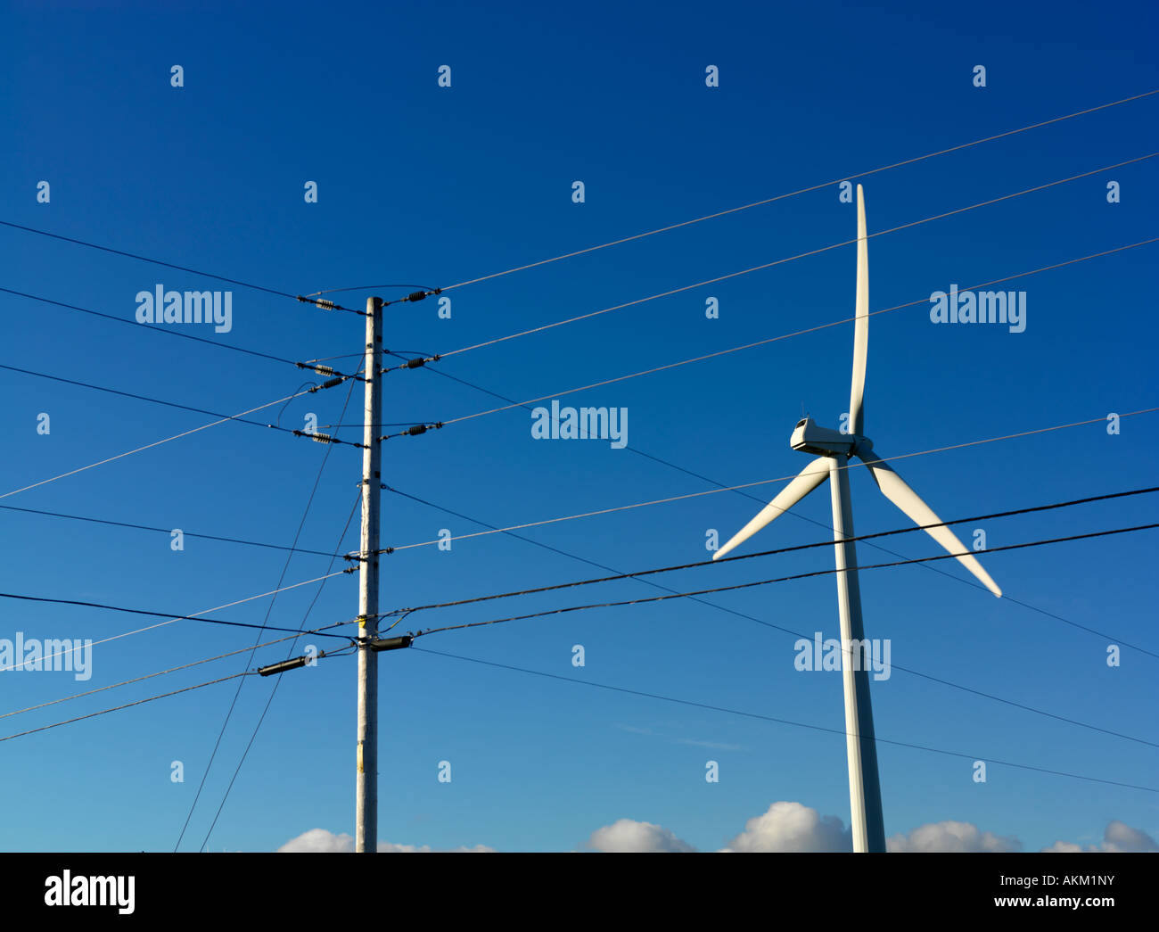 Canada Quebec Gaspesie Cap Chat wind turbine used to generate electricty and hydro power lines Stock Photo