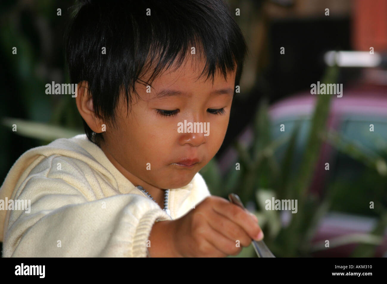 Young Thai girl eating her morning soup Stock Photo Alamy