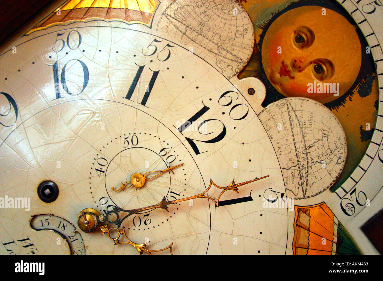 Grandfather Clock second minute hour hands moon dial English Cottage England UK United Kingdom GB Stock Photo