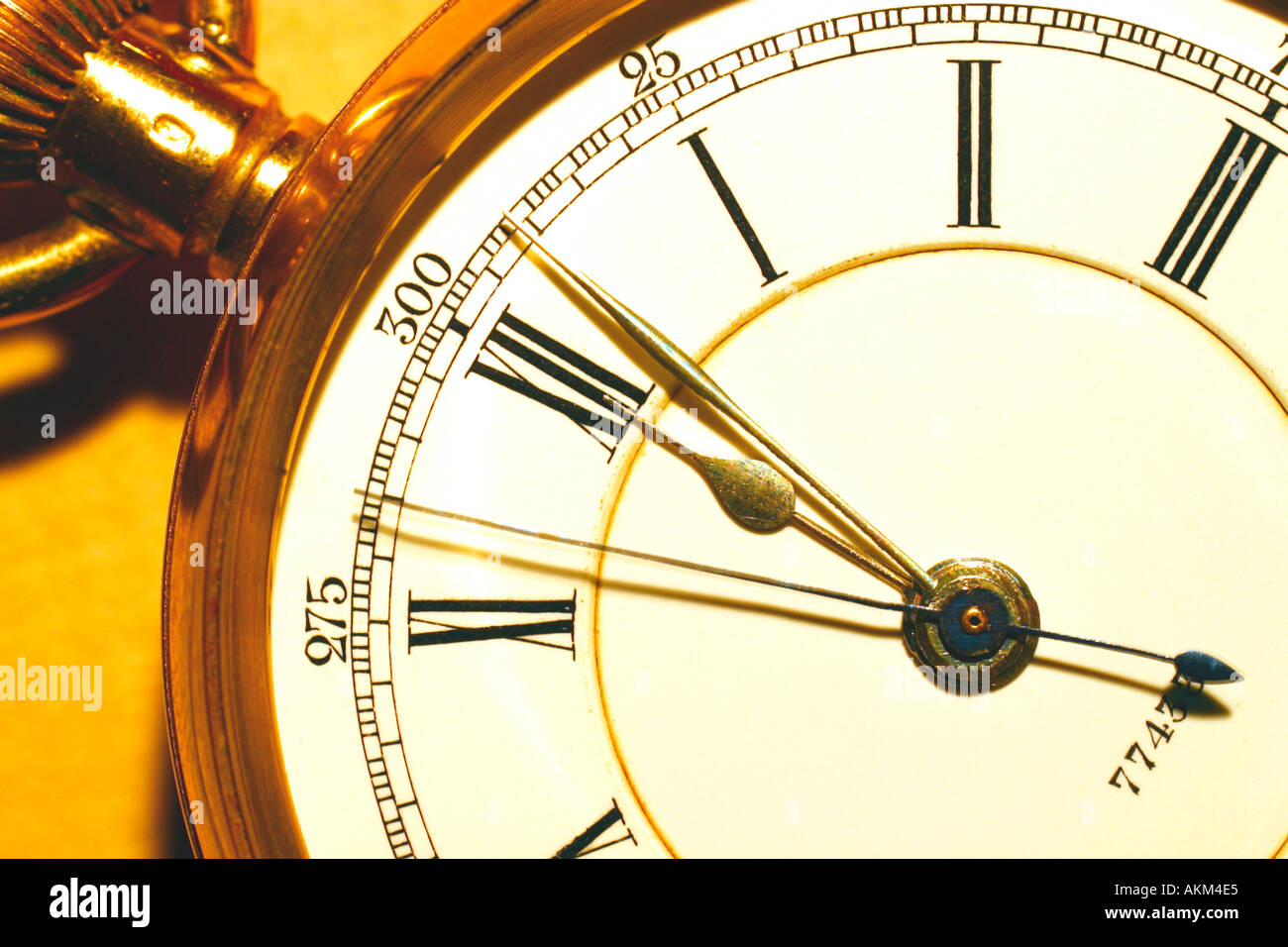 Time on English antique gold fob watch shows midday 12 o clock 1200