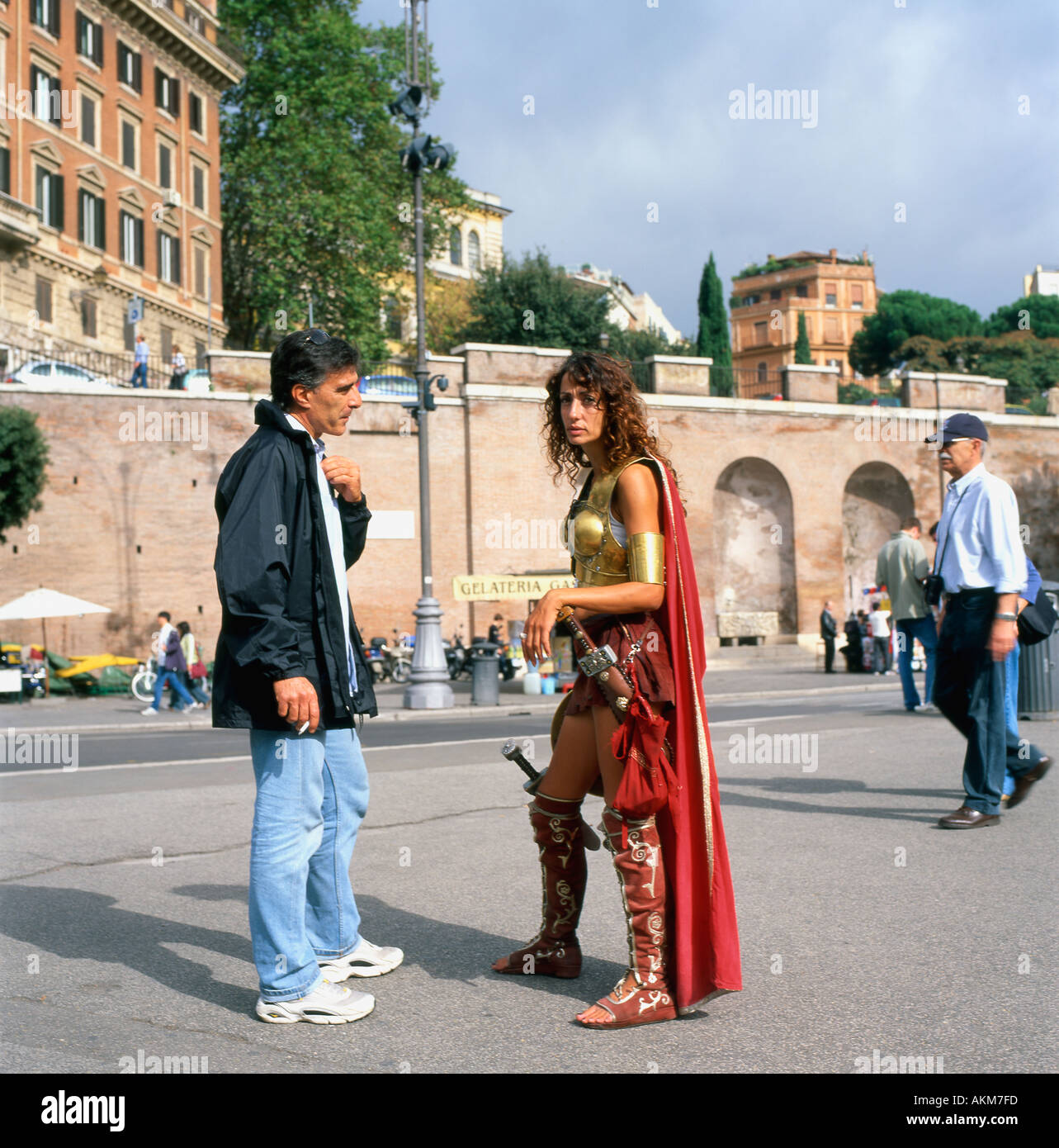 Attractive Italian woman Roman Centurion guide in fancy dress talking to a  tourist outside the Colosseum Rome Italy Europe EU KATHY DEWITT Stock Photo  - Alamy