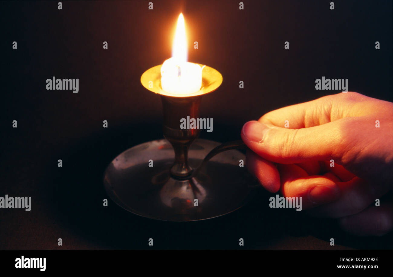 hand holding candle holder Stock Photo Alamy