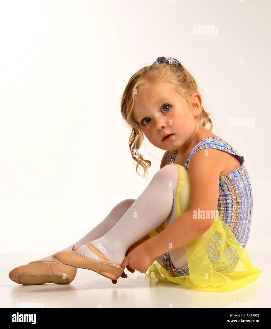 Girl putting on dancing shoe at McMaster Studio Stock Photo Alamy