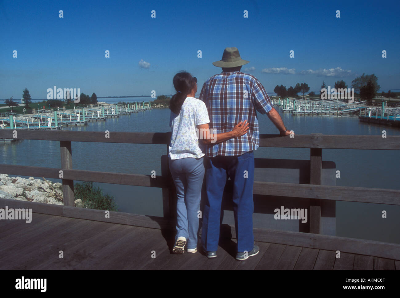 Couple at Empty boat Harbor Stock Photo