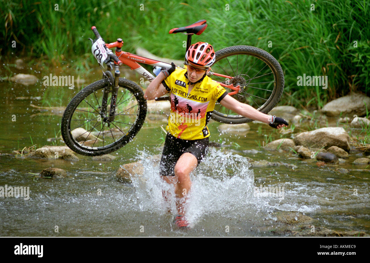 Female fords a stream Mountain bike race competition test abilities of ...