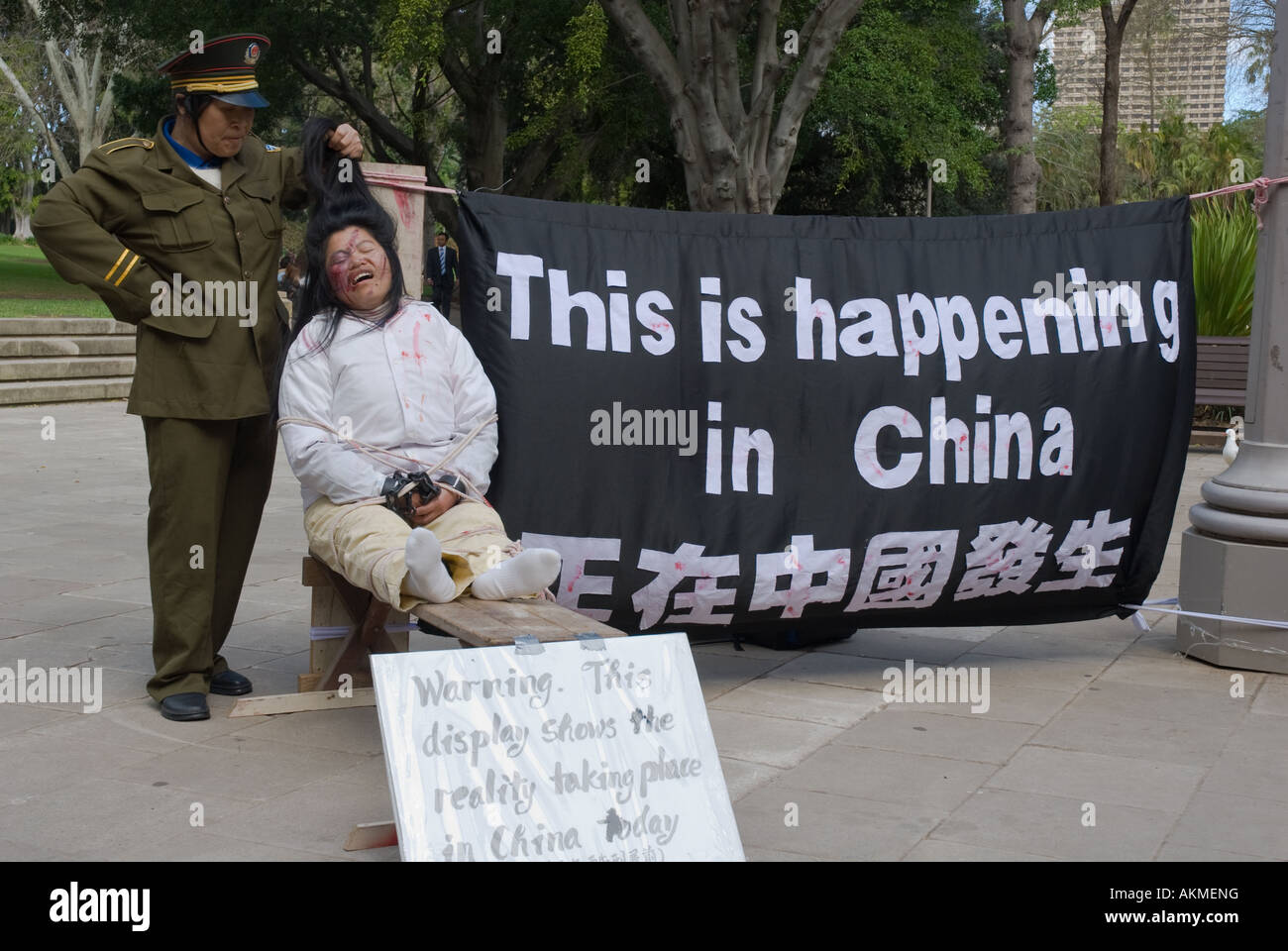 A graphic anti-persecution protest by the Falun Gong aka Falun Dafa, during the APEC summit in Sydney, Australia.                              cesdeh Stock Photo