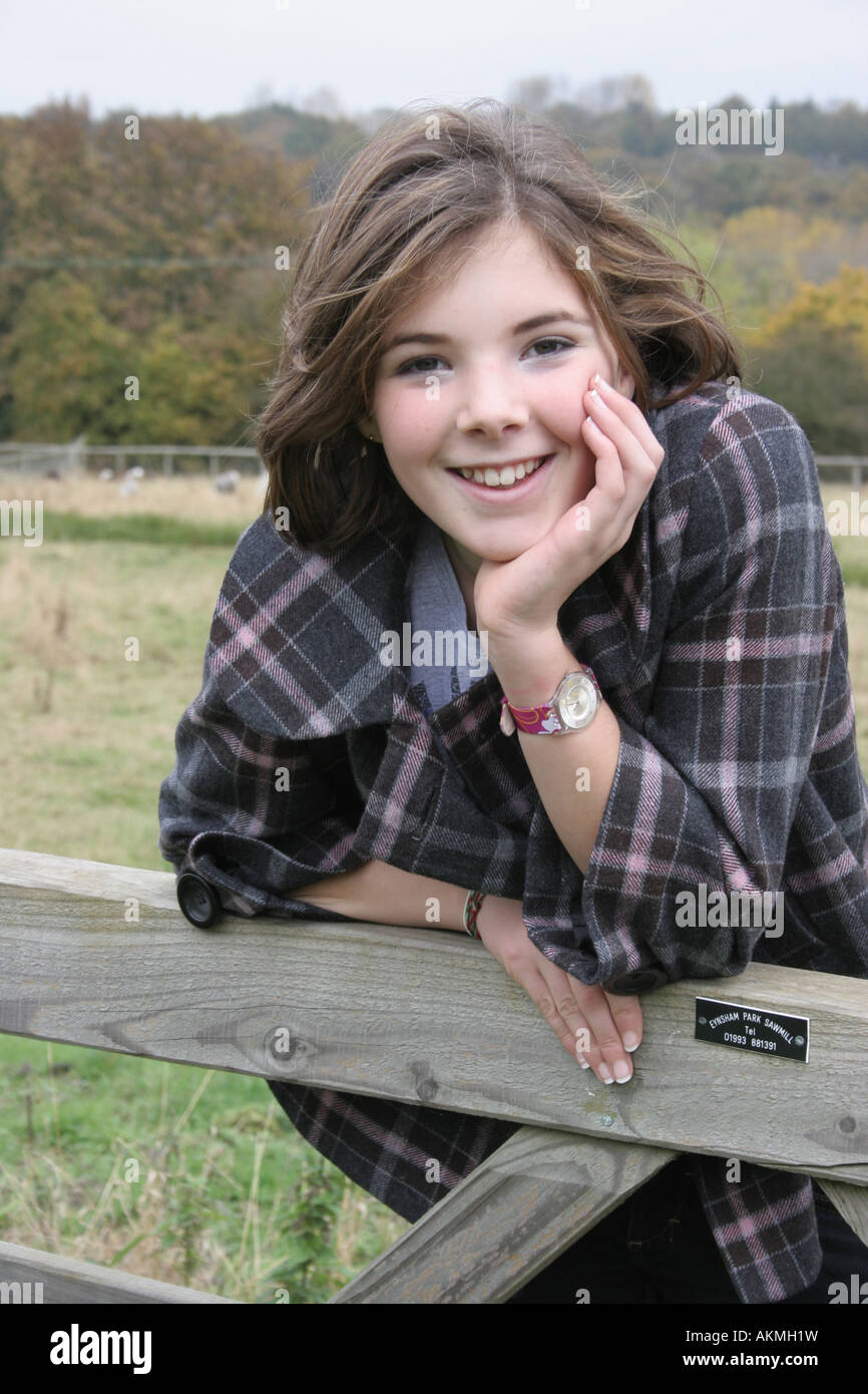 A environmental portrait of a thirteen year old girl in rural England. Stock Photo