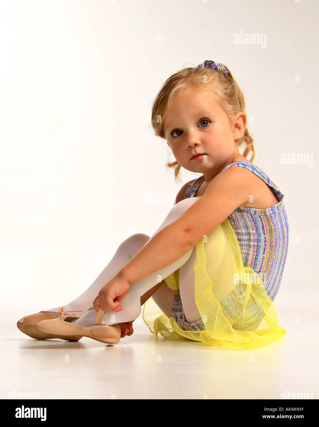 Girl putting on dancing shoe at McMaster Studio Stock Photo Alamy