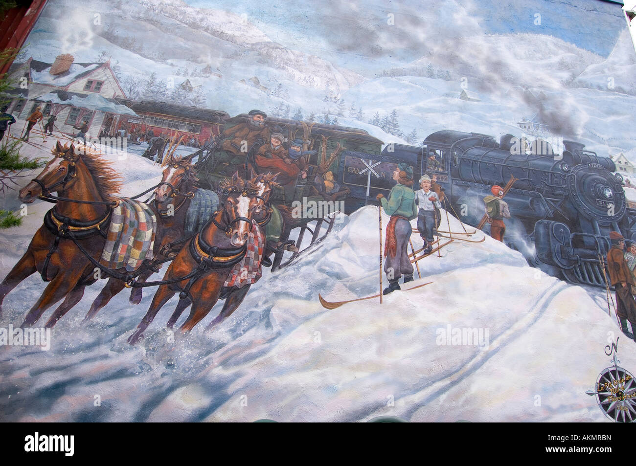 A winter scene painted on the wall of a shop St Jovite Mont Tremblant Laurentians Quebec Canada Stock Photo