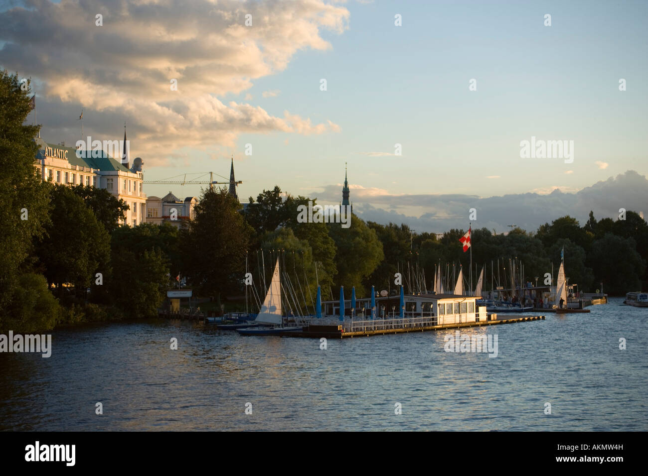 View over lake Alster to the Hotel Atlantic called the white castle at Alster Hamburg Germany Stock Photo