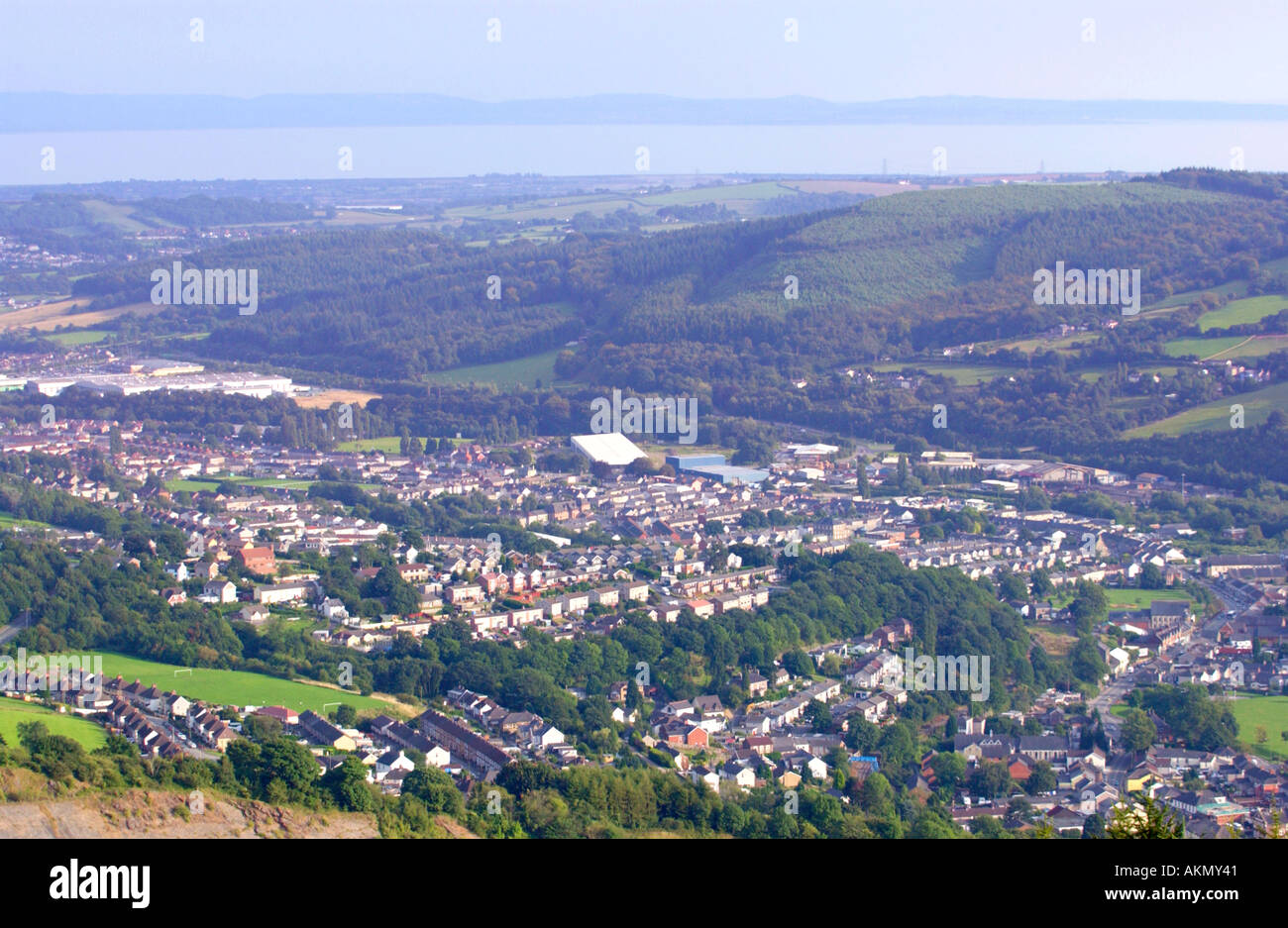 View over part of the village of Risca from Cwmcarn Forest Drive South Wales UK with Severn Estuary and West Country beyond Stock Photo