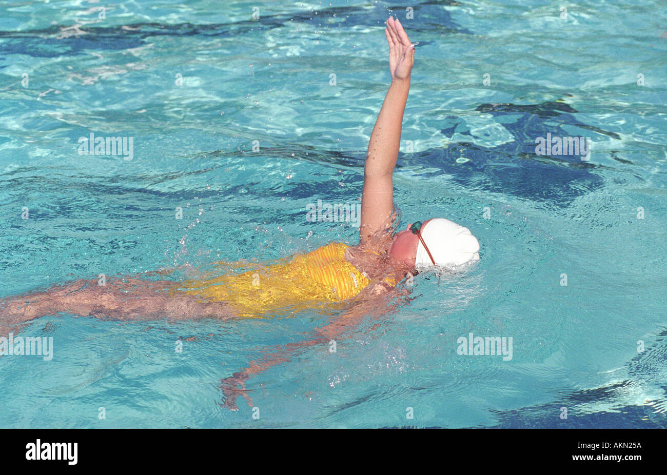 High school swimming meet includes male and female swim contestants