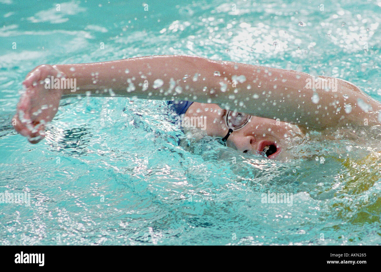 High school swimming meet includes male and female swim contestants