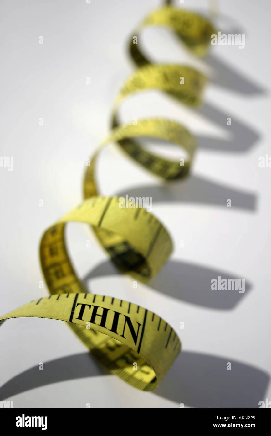 The word THIN on measuring tape Stock Photo