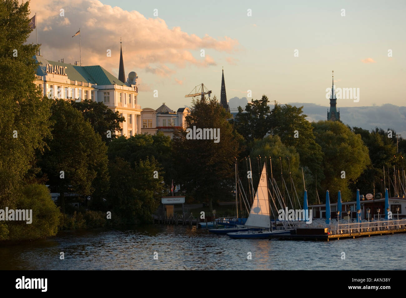 View over lake Alster to the Hotel Atlantic called the white castle at Alster Hamburg Germany Stock Photo