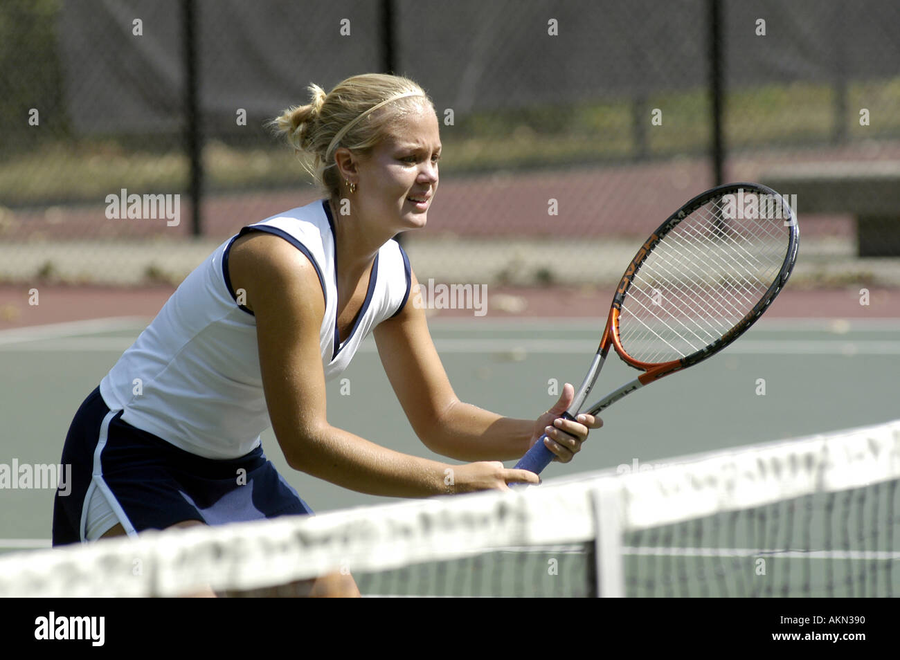 Female doubles match at a high school tennis meet Stock Photo