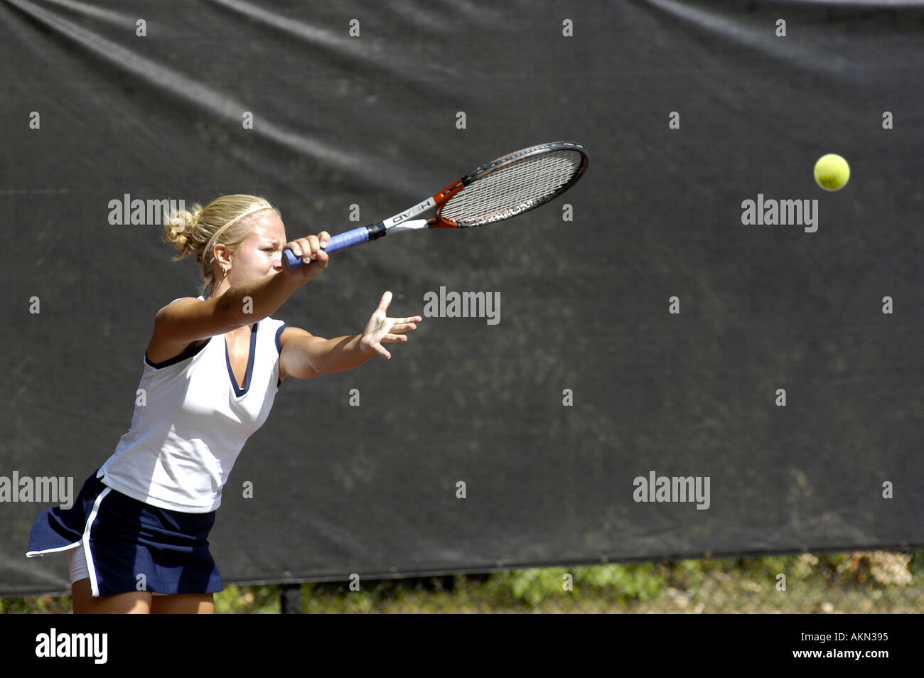 Female doubles match at a high school tennis meet Stock Photo Alamy