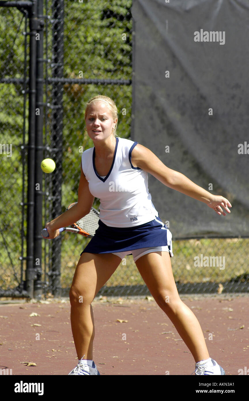 Female doubles match at a high school tennis meet Stock Photo Alamy