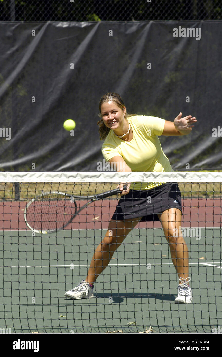 Female doubles match at a high school tennis meet Stock Photo Alamy