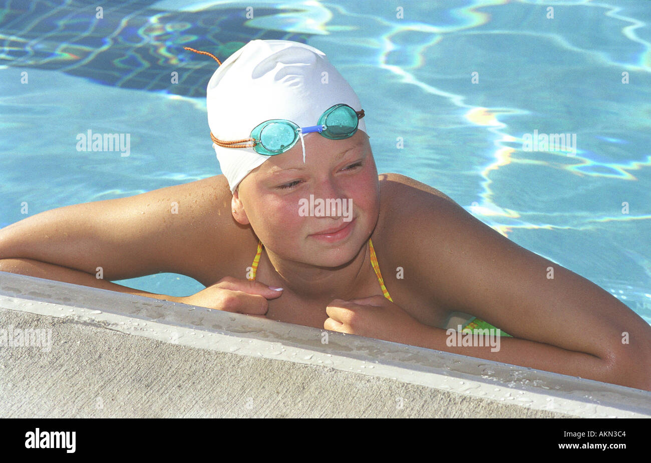 High school swimming meet includes male and female swim contestants