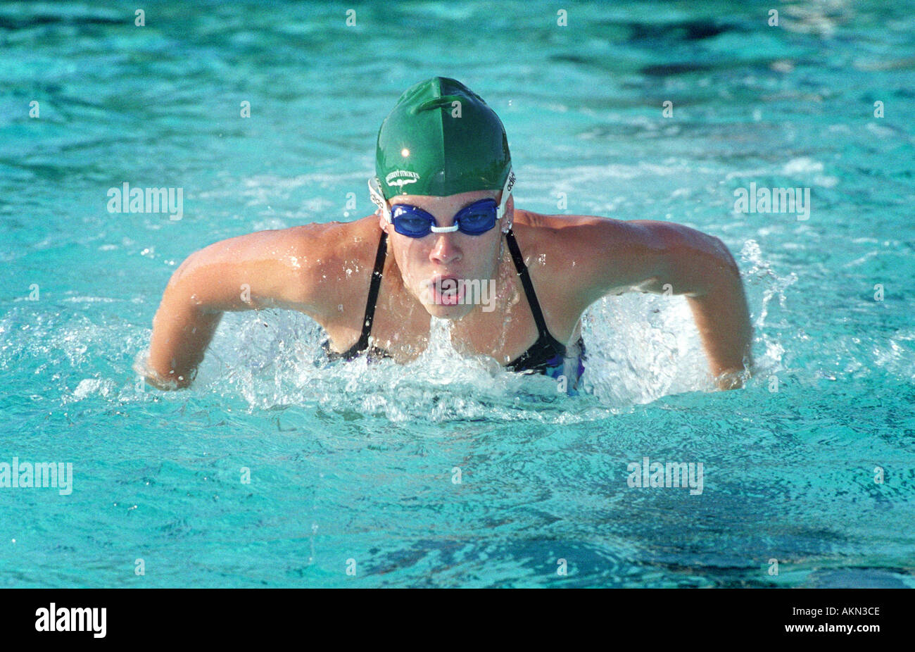 High school swimming meet includes male and female swim contestants