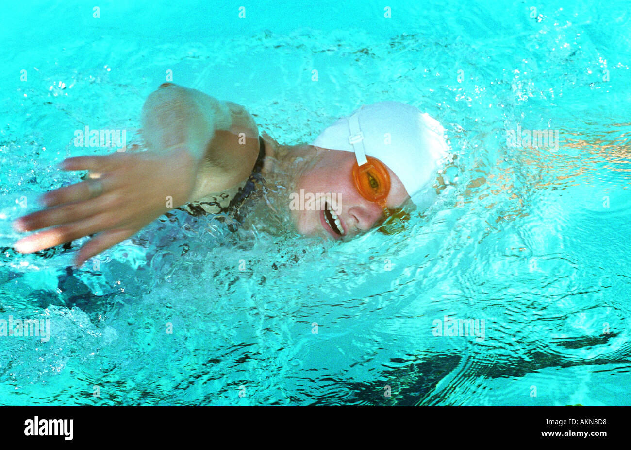 High school swimming meet includes male and female swim contestants