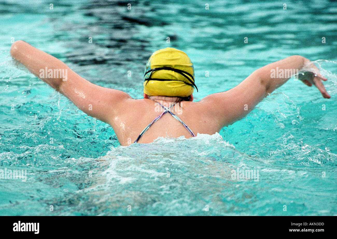 High school swimming meet includes male and female swim contestants