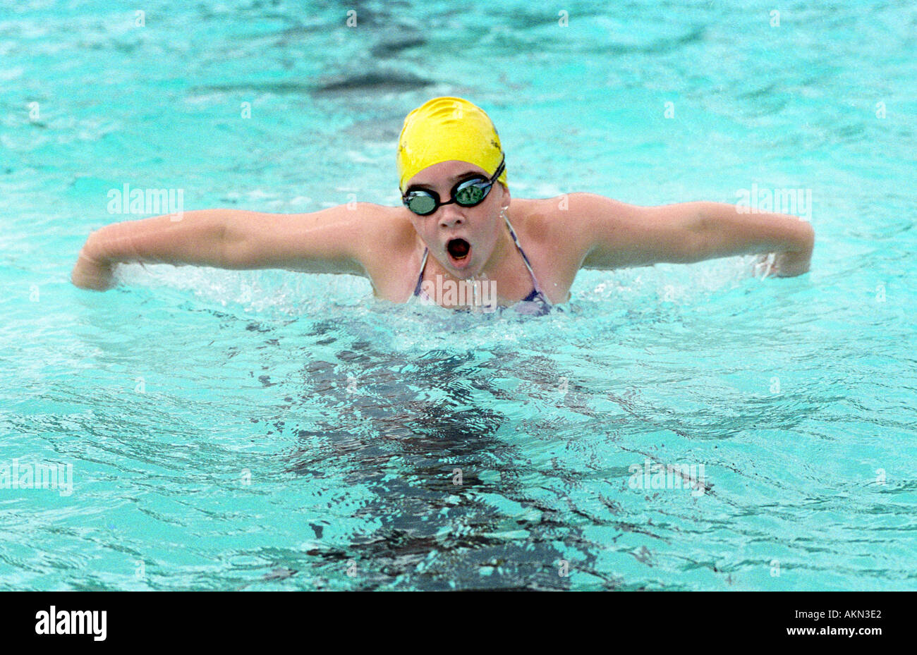 High school swimming meet includes male and female swim contestants