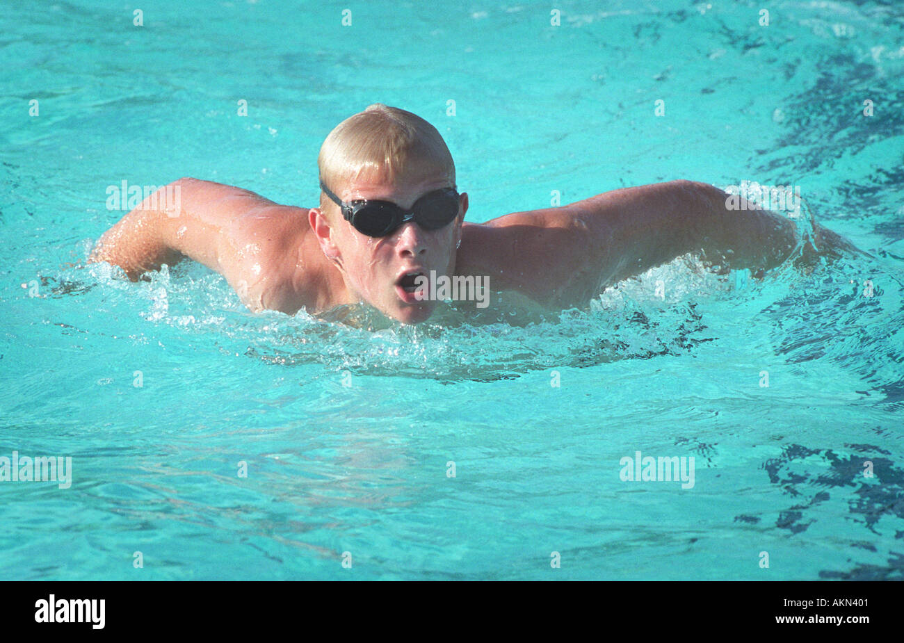 High school swimming meet includes male and female swim contestants