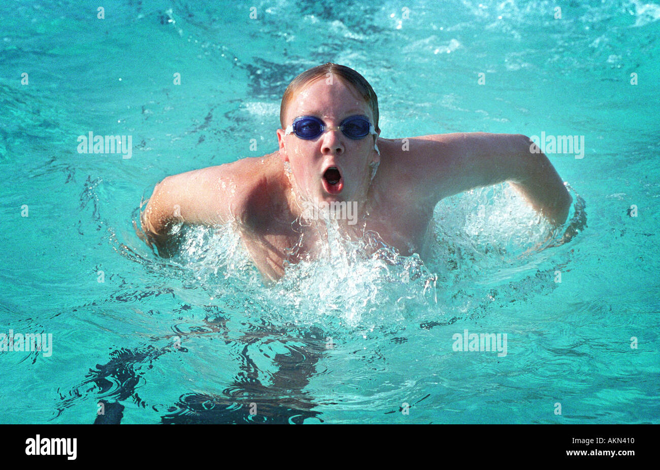 High school swimming meet includes male and female swim contestants