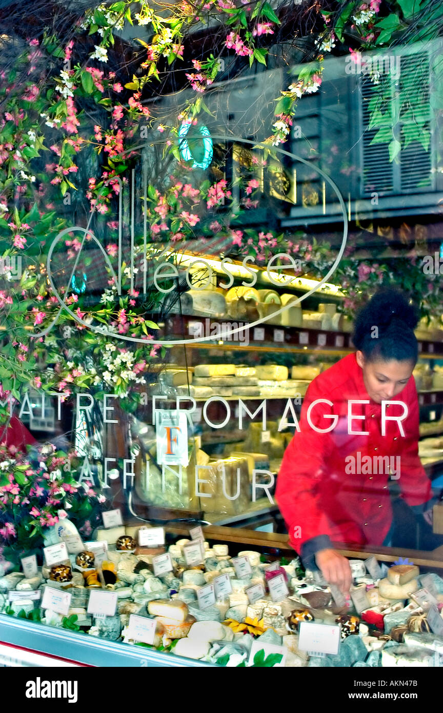 Paris France, French Cheese Store 'Alleosse' Fromages Window Display Fresh Food, woman in french window, fromagerie Paris Stock Photo