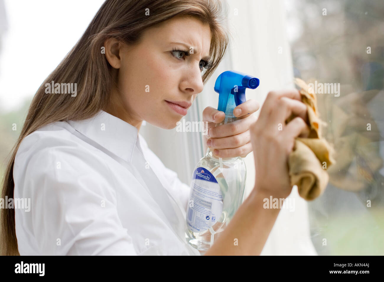 Woman cleaning window Stock Photo