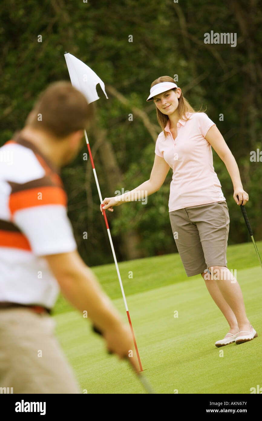 A couple golfing Stock Photo