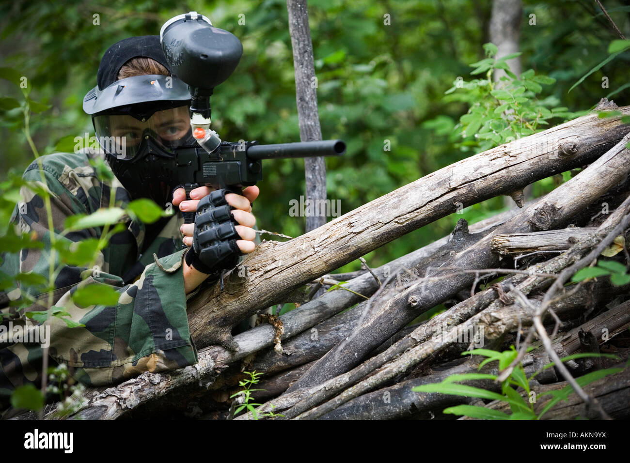 Male aiming a paintball gun Stock Photo Alamy