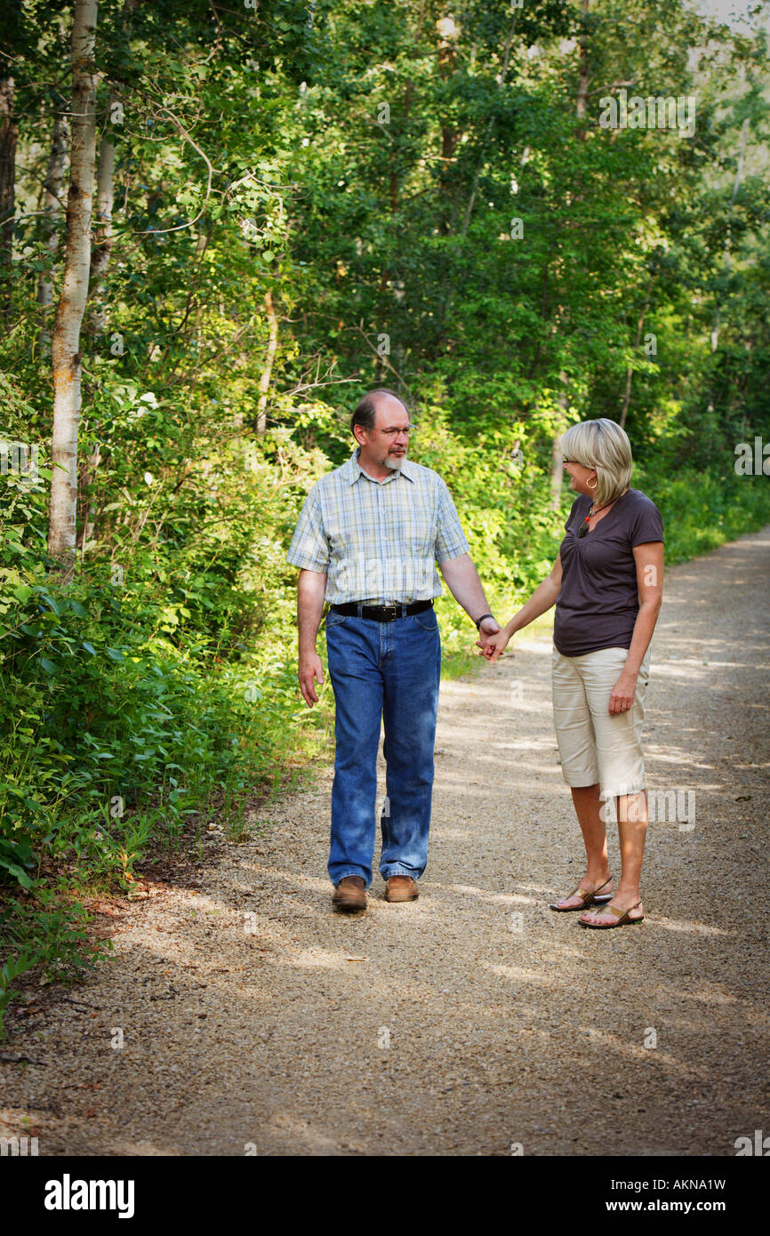 Husband and wife on walking trail Stock Photo