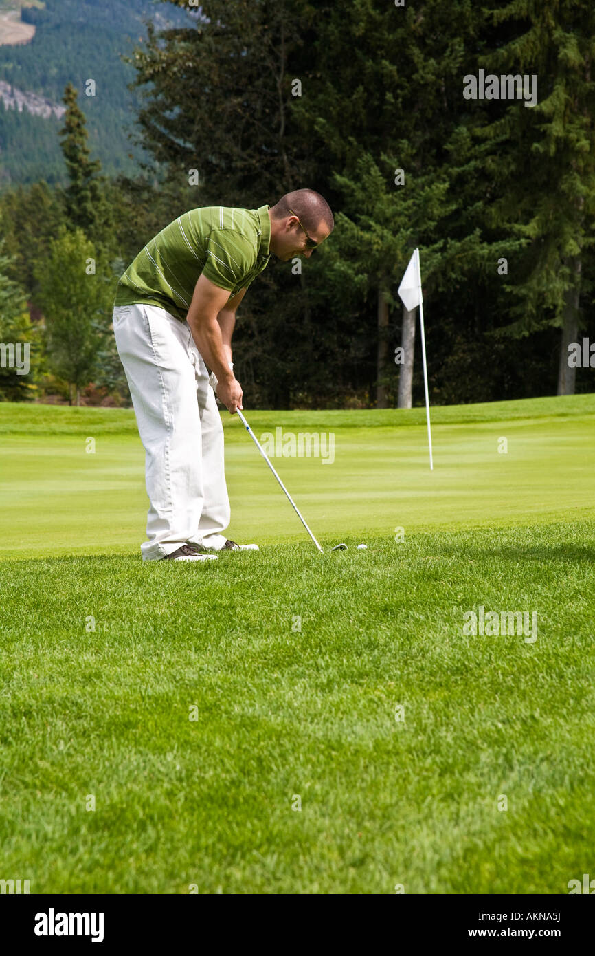 A man playing golf, Fairmont, BC, Canada Stock Photo