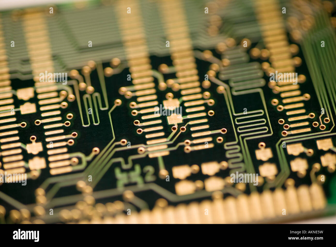 Close up photograph of computer circuit board gold connectors and
